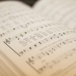 shallow focus photography of musical note book
